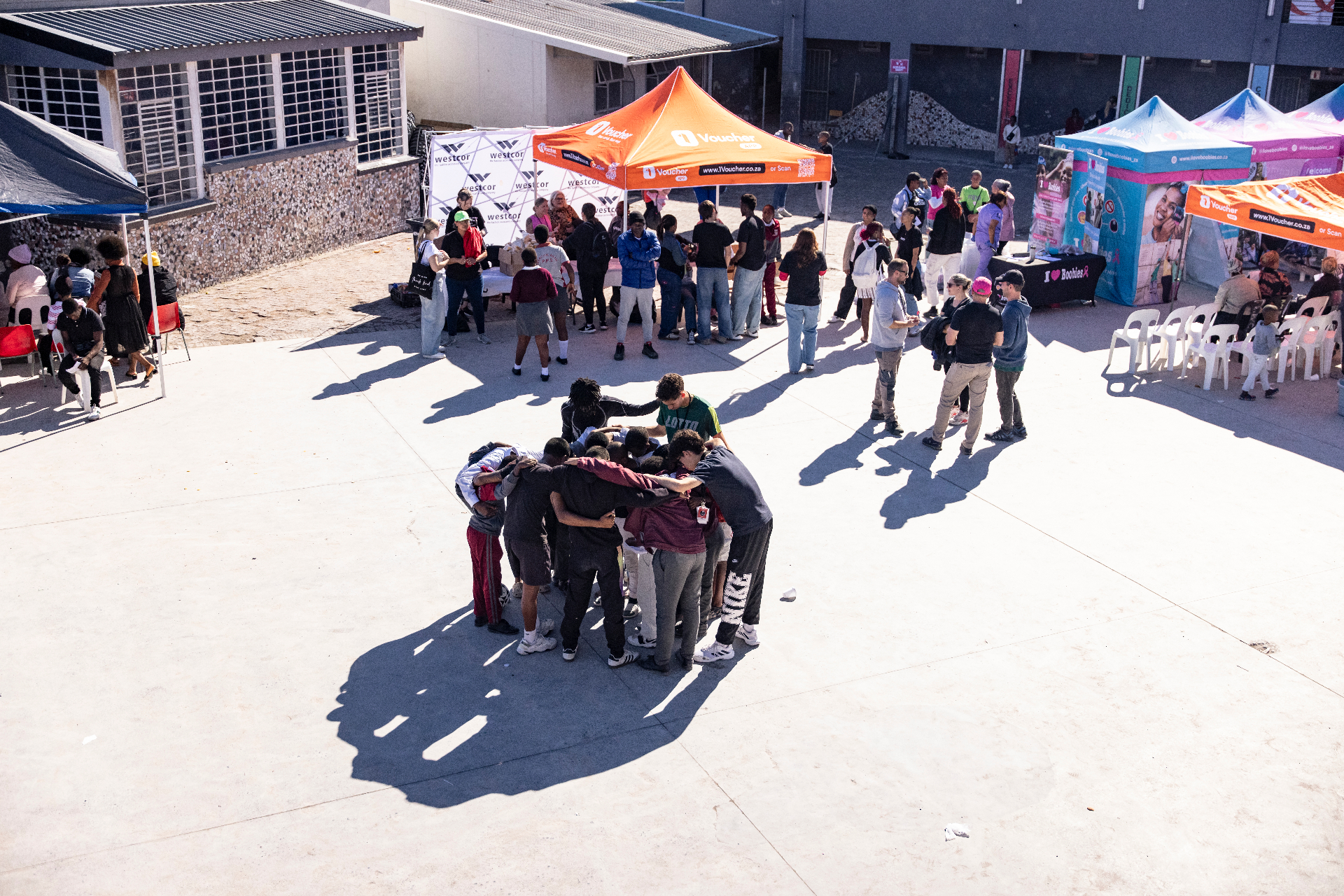 Community circle of support at an outreach event